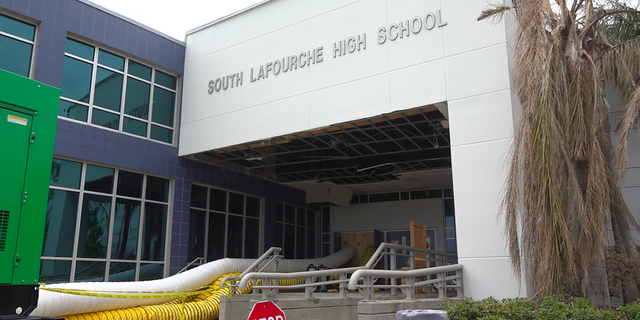 Dehumidifiers are running daily to dry the building after major flooding. 