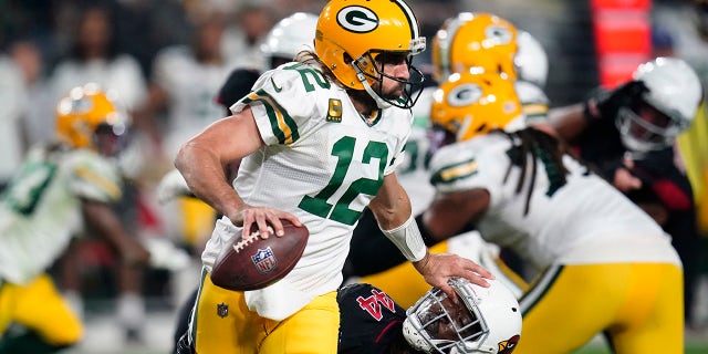 Green Bay Packers quarterback Aaron Rodgers eludes the rush during the first half against the Arizona Cardinals on Oct. 28, 2021, in Glendale, Arizona.