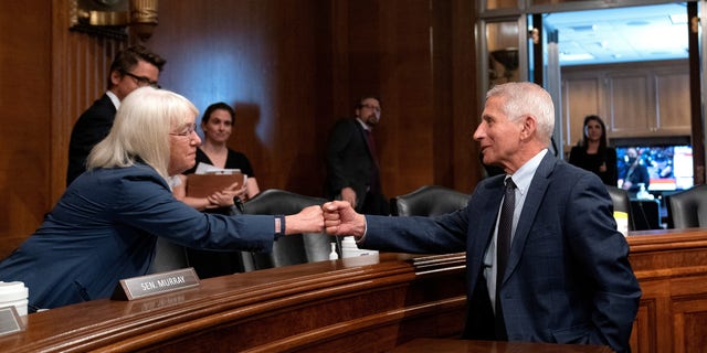 Fauci fist-bumping Sen. Patty Murray, D-Wash., in July.