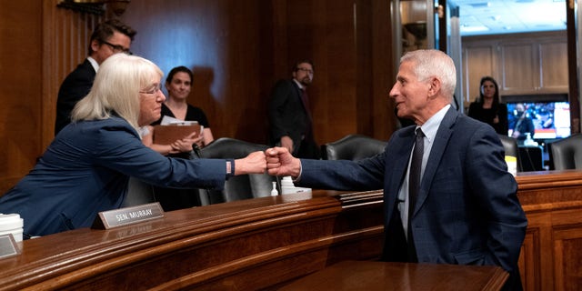 Fauci fist-bumping Sen. Patty Murray, D-Wash., in July.