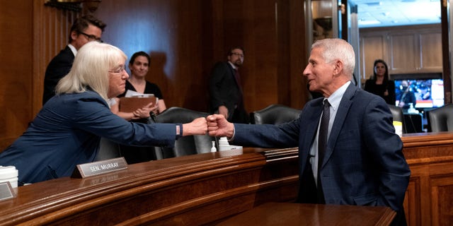 Fauci fist-bumping Sen. Patty Murray, D-Wash., in July.