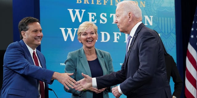 President Biden shakes hands with former White House Chief of Staff Ron Klain as Energy Secretary Jennifer Granholm looks on at the White House on June 30, 2021.