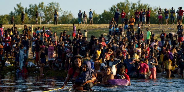 Haitian migrants in the Rio Grande as seen from Ciudad Acuna, Coahuila state, Mexico, on Sept. 20.