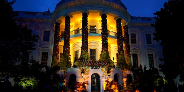 The South Lawn of the White House is lit during a Halloween celebration at the White House in Washington on Oct. 25, 2020.