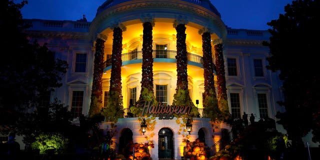 The South Lawn of the White House is lit during a Halloween celebration at the White House in Washington on Oct. 25, 2020. 