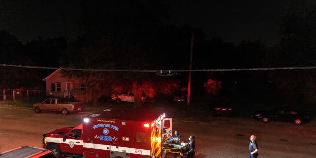 Houston Fire Department EMS medics load a COVID-positive patient into an ambulance Aug. 20, 2021 in Houston, Texas.. (Photo by John Moore/Getty Images)