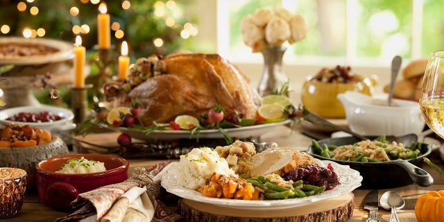 A classic Thanksgiving dinner typically includes roast turkey, stuffing, mashed potatoes, gravy, cranberry sauce, green beans, rolls and pies