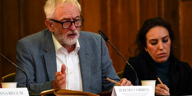 Britain's former leader of the Labour Party Jeremy Corbyn, left, and Stella Moris, partner of Julian Assange, attend the "Belmarsh Tribunal" at Church House in London on Oct. 22, 2021. 