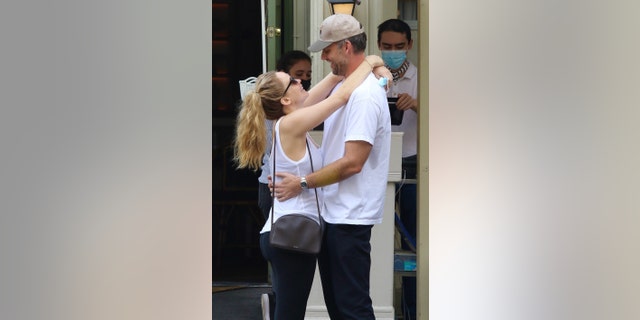 Parents-to-be Jennifer Lawrence and husband Cooke Maroney look all loved up while having a sweet PDA moment after having lunch in downtown Manhattan.