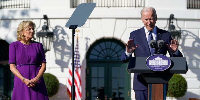 First lady Jill Biden, left, listens as President Joe Biden, right, speaks to the 2020 and 2021 State and National Teacher of the Year recipients during an event on the South Lawn of the White House in Washington, Monday, Oct. 18, 2021. 