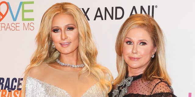 Socialite Paris Hilton saysher Mother Kathy Hilton changes the subject when she tries to talk about her past abuse. 