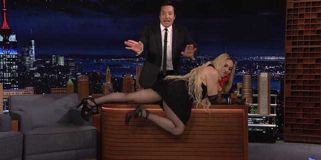 Madonna wreaked havoc during her appearance on "The Tonight Show" Thursday when she crawled across host Jimmy Fallon’s desk and flashed her tush to the audience.