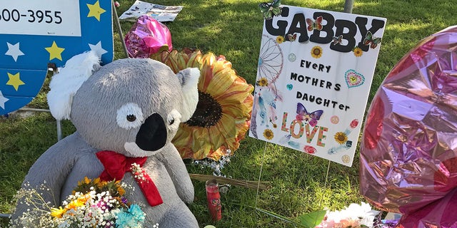 A memorial for Gabby Petito grows near City Hall in North Port, Florida with heartfelt messages left in her memory.