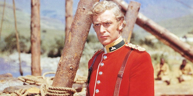Michael Caine, British actor, wearing a British Army uniform in a publicity portrait issued for the film, 'Zulu', South Africa, 1964. The historical drama depicting the Battle of Rorke's Drift, during the Anglo-Zulu War, was directed by Cy Endfield (1914-1995), and starred Caine as 'Lieutenant Gonville Bromhead'. 