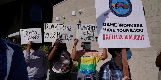 People protest outside the Netflix building in the Hollywood section of Los Angeles, Wednesday, Oct. 20, 2021. Critics and supporters of Dave Chappelle's Netflix special and its anti-transgender comments gathered outside the company's offices Wednesday. 