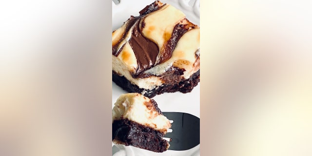 This decadent dessert is made with a brownie crust and a cheesecake topping with Nutella swirl.