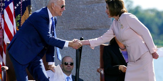 President Joe Biden shakes hands with House Speaker Nancy Pelosi of Calif., during an event marking the 10th anniversary of the dedication of the Martin Luther King, Jr. Memorial in Washington, Thursday, Oct. 21, 2021. (AP Photo/Susan Walsh)