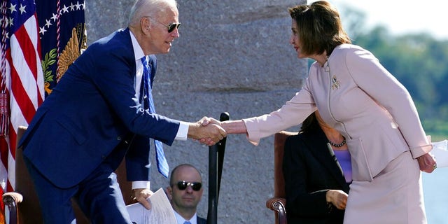 President Joe Biden shakes hands with House Speaker Nancy Pelosi of Calif., during an event marking the 10th anniversary of the dedication of the Martin Luther King, Jr. Memorial in Washington, Thursday, Oct. 21, 2021. (AP Photo/Susan Walsh)