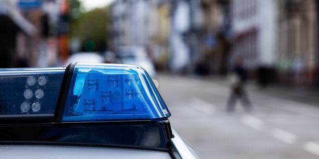 A police car stands at the side of the road in Freiburg. Recently, five juveniles escaped from a Louisiana detention center.