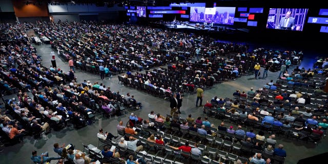 In this June 16, 2021, file photo, people attend the morning session of the Southern Baptist Convention annual meeting in Nashville, Tennessee. (AP Photo/Mark Humphrey, File)