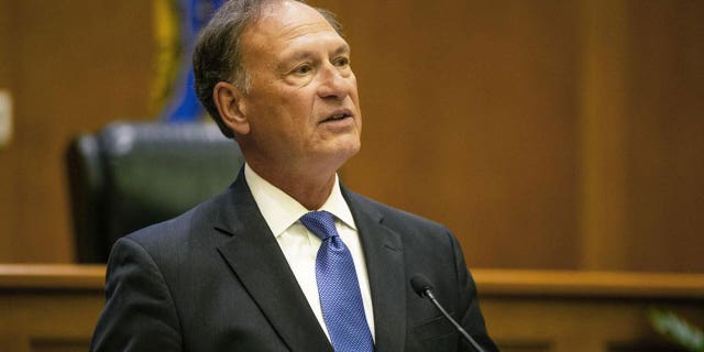 Supreme Court Justice Samuel Alito addresses the audience during the "The Emergency Docket" lecture Thursday, Sept. 30, 2021 in the McCartan Courtroom at the University of Notre Dame Law School in South Bend, Ind. 