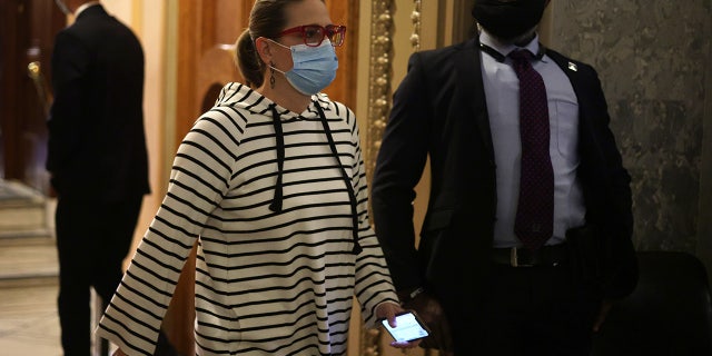 U.S. Sen. Kyrsten Sinema leaves after a vote at the U.S. Capitol October 25, 2021 in Washington, DC. (Photo by Alex Wong/Getty Images)