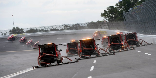 NASCAR attempted to dry the Talladega track with its Air Titan blower trucks.