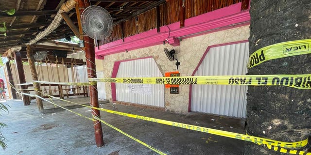 Police security tape covers the exterior of a restaurant the day after a fatal shooting in Tulum, Mexico, Friday, Oct. 22, 2021. (AP Photo/Christian Rojas)
