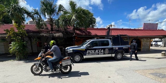 A police vehicle is parked outside the restaurant the day after a fatal shooting in Tulum, Mexico on Friday, October 22, 2021. (AP Photo / Christian Rojas)