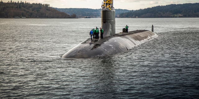 In this Dec. 15, 2016, photo, provided by the U.S. Navy, the Seawolf-class fast-attack submarine USS Connecticut (SSN 22) departs Puget Sound Naval Shipyard for sea trials following a maintenance availability. (Thiep Van Nguyen II/U.S. Navy via AP)