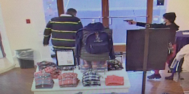 An armed suspect pointed a handgun at a store employee who confronted him, authorities said.