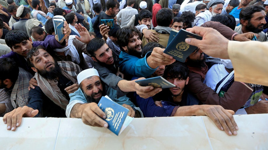 An Afghan crowd becomes chaotic as they vie for visas.