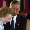 U.S. Secretary of State Colin Powell and former British Prime Minister Baroness Margaret Thatcher attend a flag raising ceremony in Kuwait to mark its 40th National Day and the 10th anniversary of liberation from Iraq's seven-month occupation. Thousands of people, including government officials,