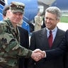 U.S. Secretary of State Colin Powell (3R), on his first trip to the Balkans, meets the international community's High Representative to Bosnia Wolfgang Petritsch (C) and Commander of the NATO-led Stabilisation Force (SFOR) General Michael Dodson (L), at the Sarajevo airport, April 13, 2001. MZ