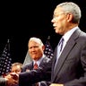 Texas Governor and Republican presidential candidate George W. Bush shakes hands with General Colin Powell (Ret.) as General Norman Schwarzkopf (Ret.) looks on at Wright State University in Dayton, Ohio September 7, 2000. Bush and the Generals spoke about the decline of the U.S. military under the Clinton administration. RTW/RCS