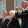Summit general chairman Colin Powell (R) points to the audience thanking people for their support as he stands with first lady Hillary Rodham Clinton (L), former President and first lady George and Barbara Bush outside historic Independence Hal, during closing ceremonies for the President's Summit for America's Future in Philadelphia, April 29. Powell called the three-day summit, organized to draw attention to America's social youth and support system, a success. VOLUNTEER