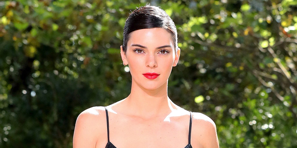 Kendall Jenner shows skin in revealing cut-out dress at friend's wedding