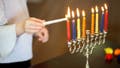 Jewish people around the world observe the holiday with a special Hanukkah menorah, which has nine candle arms.