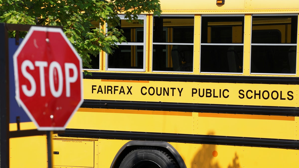 A Fairfax County school bus sits in a depot, a day after it was announced the county would begin the school year all online, in Lorton, Virginia, U.S., July 22, 2020.