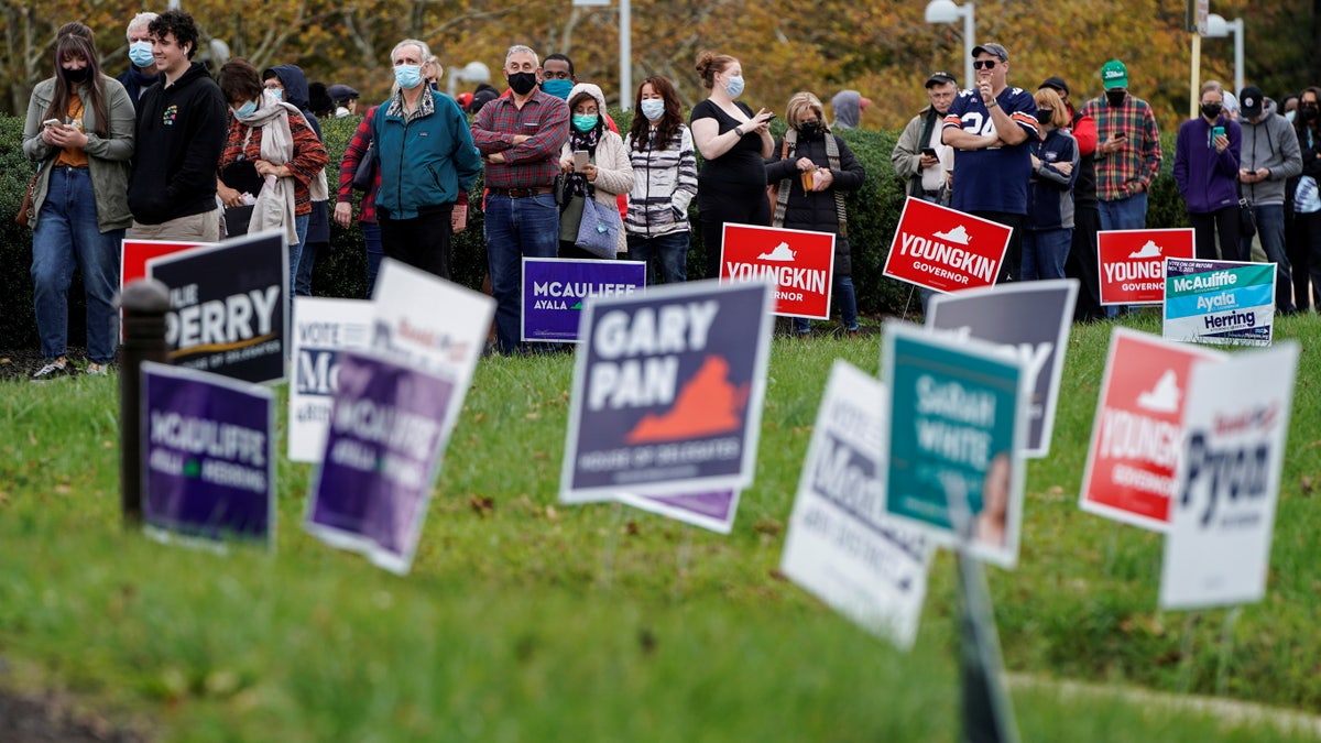 People wait in line on the last day of early voting in the Virginia gubernatorial election in Fairfax, Virginia, U.S., October 30, 2021. REUTERS/Joshua Roberts