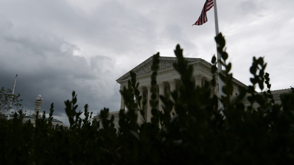 Storm clouds roll in over the Supreme Court in Washington on Sept. 1, 2021. 