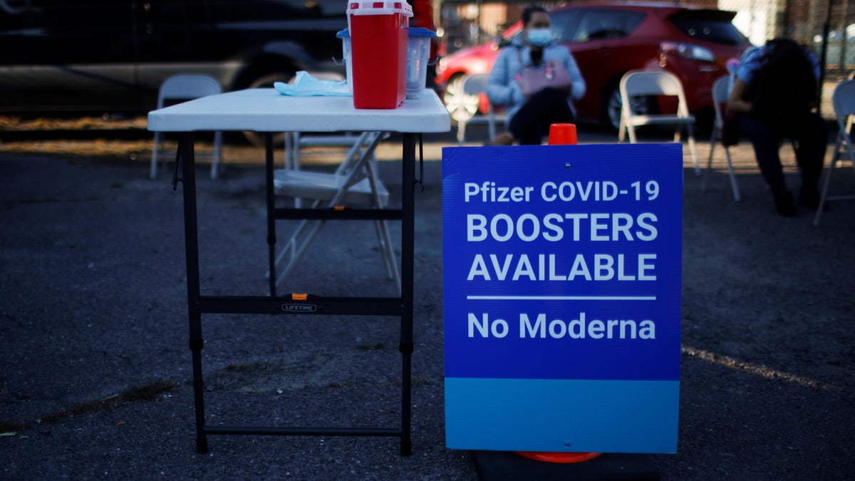 A sign informs potential patients that "Pfizer COVID-19 Boosters Available, No Moderna" at a coronavirus disease vaccine clinic at La Colaborativa, in Chelsea, Massachusetts, U.S., November 9, 2021.    REUTERS/Brian Snyder