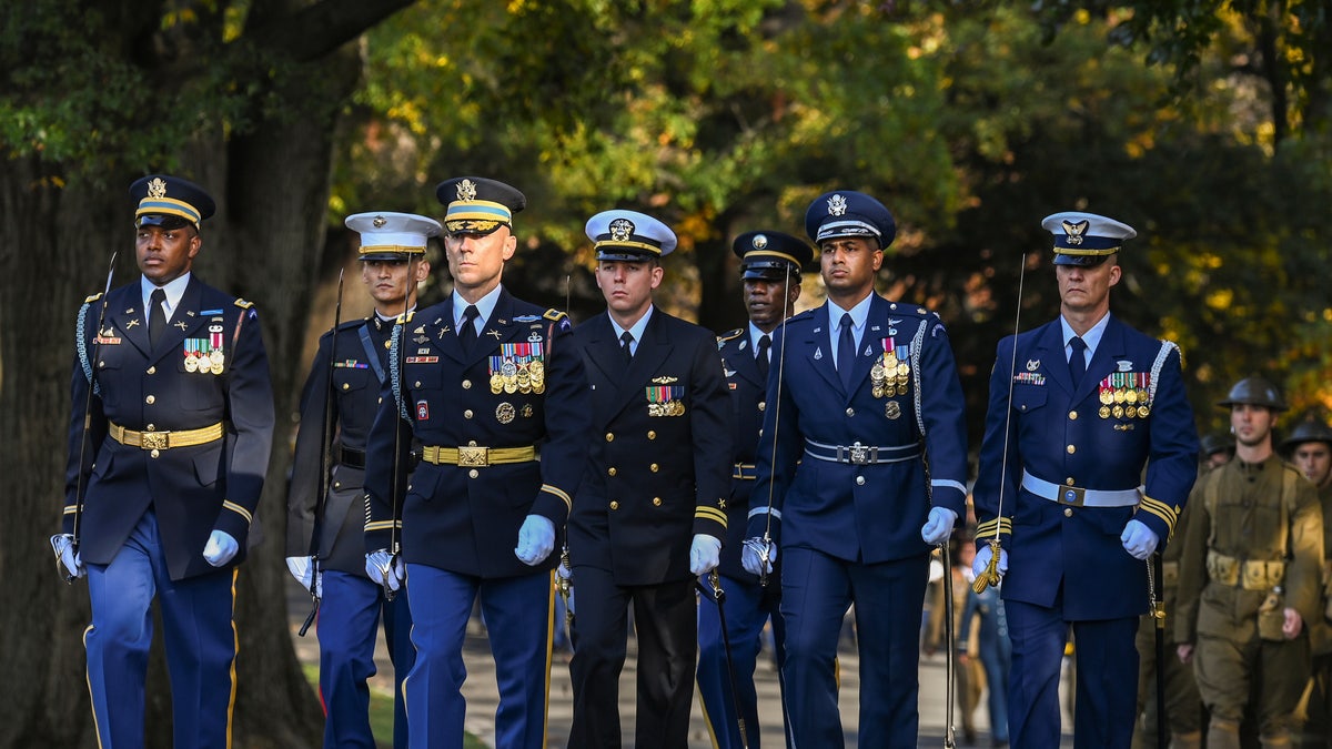 A full honors procession honoring the centennial anniversary of the Tomb of the Unknown Soldier takes place at Arlington National Cemetery on Veterans Day, in Arlington, Virginia on November 11, 2021. 