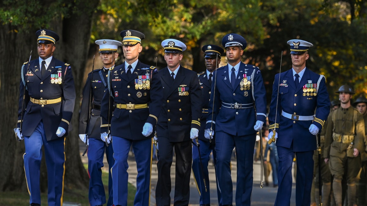 A full honors procession honoring the centennial anniversary of the Tomb of the Unknown Soldier takes place at Arlington National Cemetery on Veterans Day, in Arlington, Virginia on November 11, 2021.