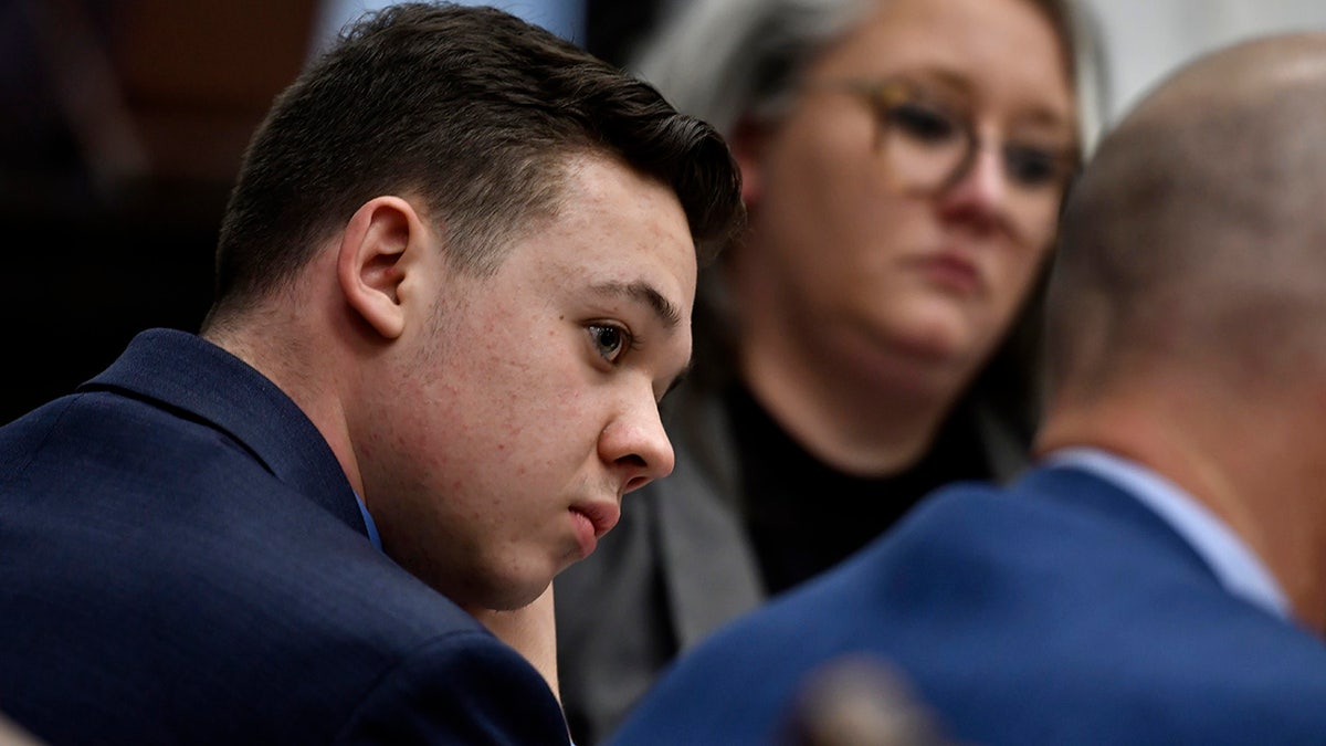 Kyle Rittenhouse listen as his attorney, Mark Richards, give his closing argument during  Rittenhouse's trial at the Kenosha County Courthouse in Wisconsin on Monday, Nov. 15, 2021. (Sean Krajacic/Kenosha News/Pool via USA TODAY NETWORK)
