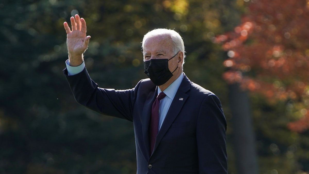 President Joe Biden waves as he walks to Marine One, to depart for Detroit, Michigan, from the White House on  November 17, 2021. 