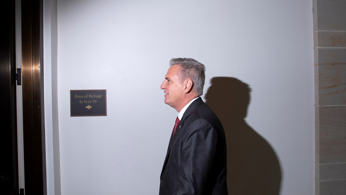 House Minority Leader Kevin McCarthy (R-CA) walks to his office following a weekly news conference at the U.S. Capitol in Washington, U.S., November 18, 2021. REUTERS/Tom Brenner