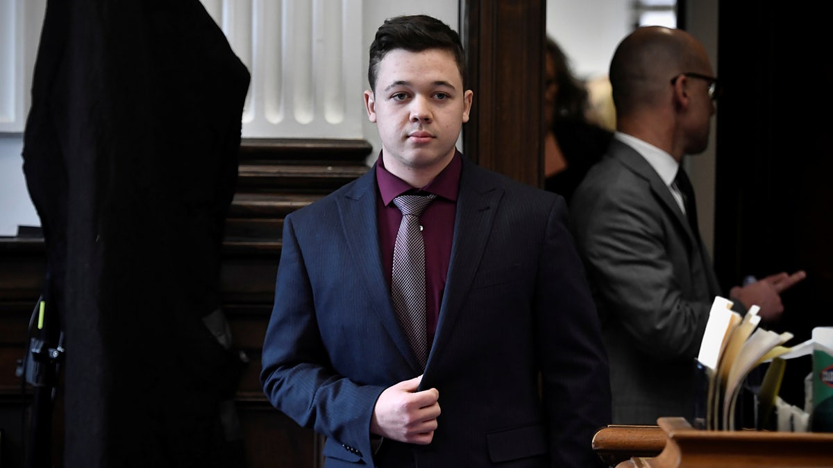 Kyle Rittenhouse walks during his trial at the Kenosha County Courthouse in Kenosha, Wisconsin, on Nov. 19, 2021.