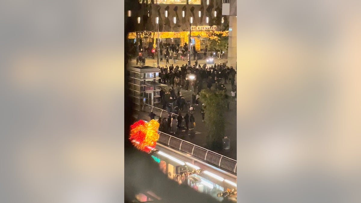 Protesters are seen during demonstrations against coronavirus disease (COVID-19) measures which turned violent in Rotterdam, Netherlands, on Friday in this still image obtained from video provided on social media. (REUTERS)