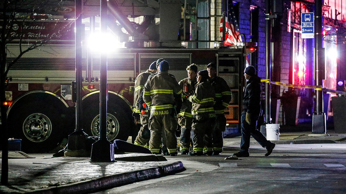 Emergency responders gather after a vehicle plowed through the Christmas Parade, leaving multiple people injured in Waukesha, Wisconsin